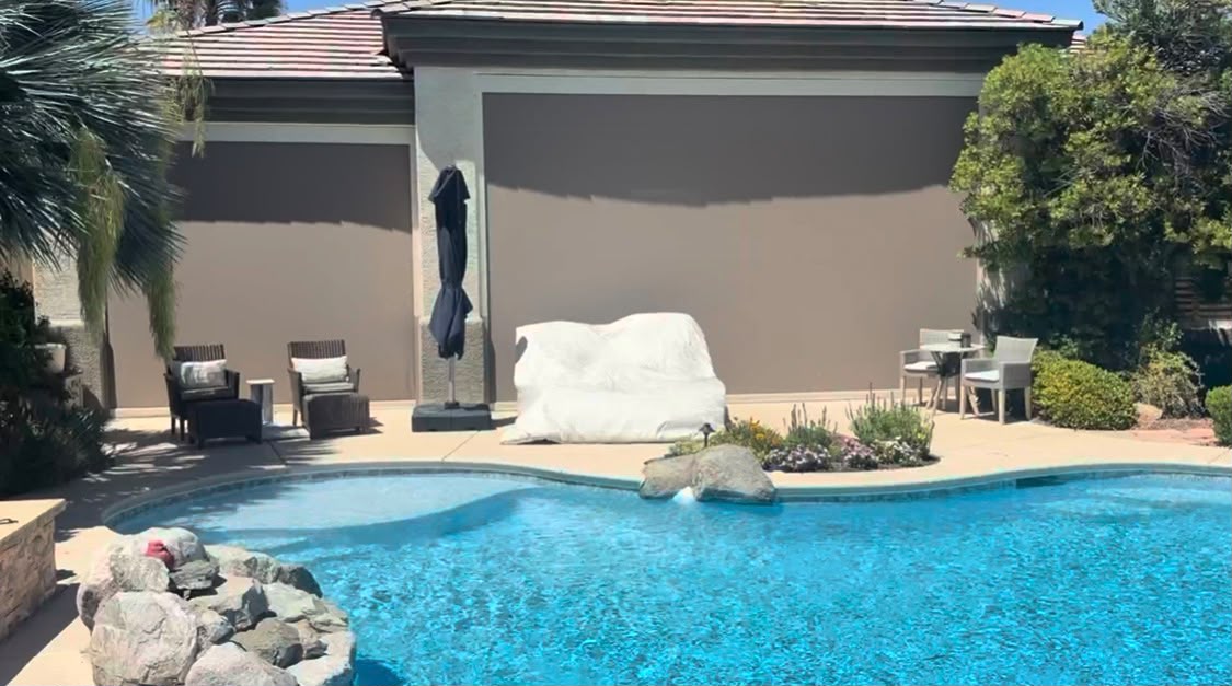 Motorized screen by pool